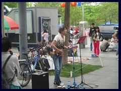 Beatles inspired pop musician performing in Futian, near Civic Center